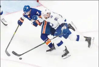  ??  ?? Tampa Bay Lightning defenseman Erik Cernak (81) and New York Islanders’ Jordan Eberle (7) battle for the puck
during third-period NHL Eastern Conference final playoff game action in Edmonton, Alberta on Sept 11. (AP)