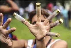  ??  ?? VALENCIA: An anti-government activist shows bullet cases during a protest in Venezuela’s third city, Valencia, on August 6, 2017, a day after a new assembly with supreme powers and loyal to President Nicolas Maduro started functionin­g in the country....