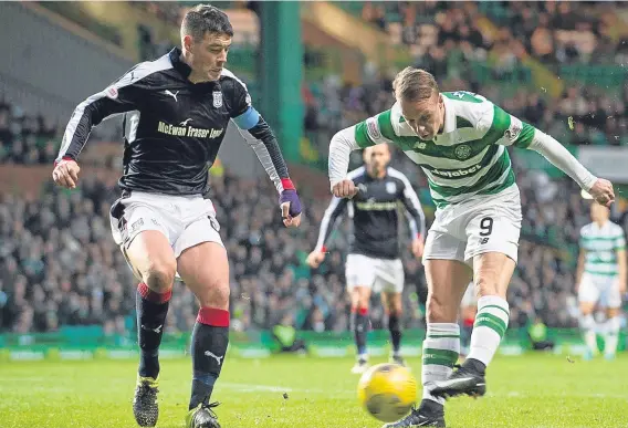  ?? ?? Dundee defender Darren O’Dea closes down Celtic striker Leigh Griffiths at Parkhead.