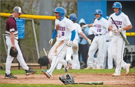  ?? DANA JENSEN/THE DAY ?? Waterford High School’s Ryan Salvador (3) celebrates as he scores a run during Saturday’s Eastern Connecticu­t Conference Division I baseball game against East Lyme at Waterford. East Lyme struck first with a home run by Aidan Ellis, but Waterford came back with five in the first inning on the way to a 9-5 victory. Go to www.theday.com to see a photo gallery from the game.