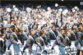  ?? EDUARDO MUNOZ ALVAREZ/AP ?? United States Military Academy cadets celebrate their graduation Saturday at Michie Stadium in West Point, N.Y. Army Gen. Mark Milley, chairman of the Joint Chiefs of Staff, delivered the commenceme­nt address, urging cadets to be ready to face the challenge of opposing great powers intent on changing today’s global order.