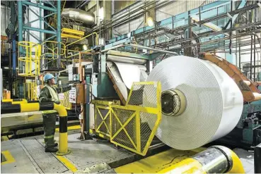  ?? Picture: Supplied ?? Work rolls on in a Hulamin factory as the company faces new duties in the US despite denying ‘dumping’ charges.