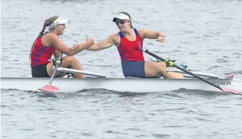  ?? JULIE JOCSAK/POSTMEDIA NEWS ?? Anna Maloney, left, and Emily Stewart of St. Catharines Rowing club win the under-19 womens double during the fourth day of racing at the 135th Royal Canadian Henley Regatta in St. Catharines on Friday.