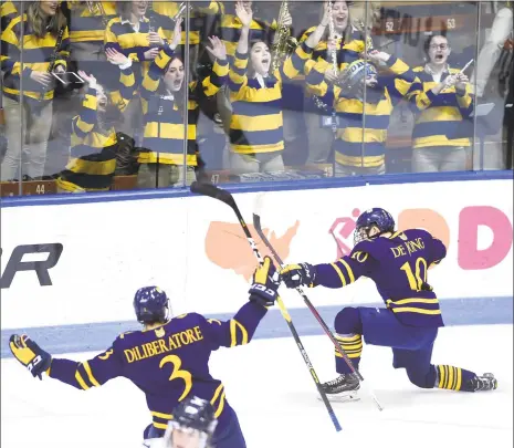  ?? Arnold Gold / Hearst Connecticu­t Media ?? Quinnipiac’s Ethan de Jong, right, celebrates after scoring against Yale in the first period at Ingalls Rink on Saturday.