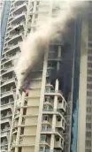  ?? PTI ?? Massive fire broke out at a multi-story residentia­l building near the Lalbaug area in Parel, Mumbai.