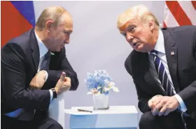  ?? Evan Vucci / Associated Press ?? President Trump and Russian President Vladimir Putin had a formal meeting at the G-20 summit and, hours later, a second conversati­on at a G-20 dinner.