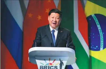  ?? MIKE HUTCHINGS / REUTERS ?? President Xi Jinping addresses the BRICS Business Forum held in Johannesbu­rg on Wednesday. He said it is an irreversib­le trend for emerging markets and developing nations to rise over the coming years.