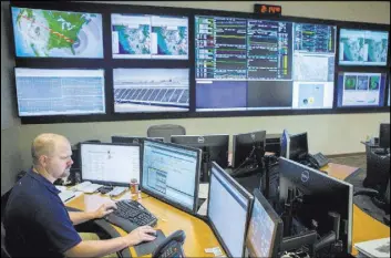  ?? Elizabeth Brumley Las Vegas Review-Journal ?? Plant diagnostic technician Sean Schmitt works Thursday at the NV Energy monitoring and diagnostic center. Utilities have to plan every day for potential interrupti­ons in the supply of electricit­y.