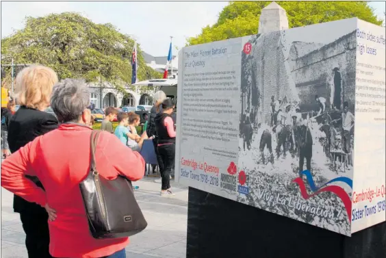  ?? Photo / Bethany Rolston ?? A photograph­ic display of 18 large panels telling the story of the liberation of Le Quesnoy in World War I captivated people at Sunday’s event.