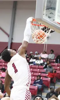  ?? ?? Liberty-eylau’s 6-foot-2 forward Tracy Revels (1) slam dunks the basketball against North Lamar during Friday night’s game in the Rader Dome. Revels scored 15 points in the Leopards’ 74-57 victory. (Photo by Melanie Allen/txksports)