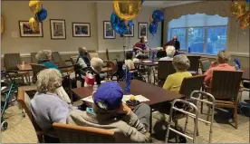  ?? COURTESY OF THE HICKMAN FRIENDS SENIOR COMMUNITY ?? Residents at the Hickman Friends Senior Community celebrate its 130-year anniversar­y by listening to some music.