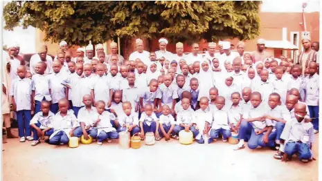  ?? PHOTO: ?? The 120 orphans sponsored to primary and secondary school by Mutum Biyu Chiefdom Magaji Isa Hunkuyi