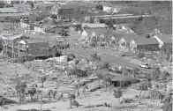  ?? AP Photo/Gerald Herbert, File ?? ■ This Oct. 12 aerial file photo shows devastatio­n from Hurricane Michael over Mexico Beach, Fla. A massive new federal report warns that extreme weather disasters, like California’s wildfires and 2018’s hurricanes, are worsening in the United States.