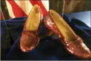  ?? JEFF BAENEN — THE ASSOCIATED PRESS ?? A pair of ruby slippers once worn by actress Judy Garland in the “The Wizard of Oz” are displayed at a news conference Tuesday at the FBI office in Brooklyn Center, Minn. Authoritie­s announced that the slippers, stolen in 2005 from the Judy Garland Museum in Grand Rapids, Minn., were recovered in a sting operation.