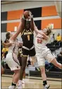  ?? STEVE HARE — FOR THE NEWSHERALD ?? Asia Nicholson of Brush tries to get to the basket while defended by North’s Hailie Wilson (left) and Dori Siekaniec during the Arcs’ 59-46 win over the Rangers on Jan. 20.