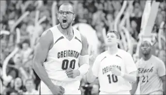  ?? By Matt Ryerson, US Presswire ?? Rising stock: Creighton center Gregory Echenique lets out a scream during the Bluejays’ 81- 79 win against Long Beach State on Saturday. The game was a centerpiec­e of Bracketbus­ters, ESPN’S midmajor showcase.