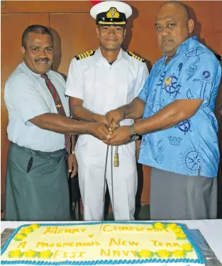  ?? Photo: Ronald Kumar ?? From left: Major Ilaitia Tuwere, Commander of the Day, Sekove Yaqona and Republic of Fiji Military Forces Navy Commander Captain (Navy) Humphrey Tawake cutting the cake during the celebratio­n at Stanley Brown Naval Base, Walu Bay, Suva, on December 12, 2018.