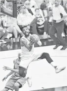  ?? Jason Miller / Getty Images ?? Kyrie Irving gets loose in the first half on a night he carried the Cavaliers while LeBron James battled foul trouble.