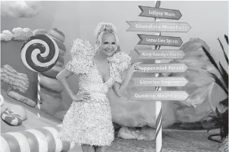  ?? [FOOD NETWORK PHOTO] ?? Kristin Chenoweth hosts the new Food Network competitio­n series “Candy Land,” based on the classic board game. “Candy Land” premieres at 8 p.m. Nov. 15.