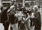  ?? Vincent Yu / Associated Press ?? American John Clancey, right, was the first foreigner arrested under Hong Kong’s national security law.