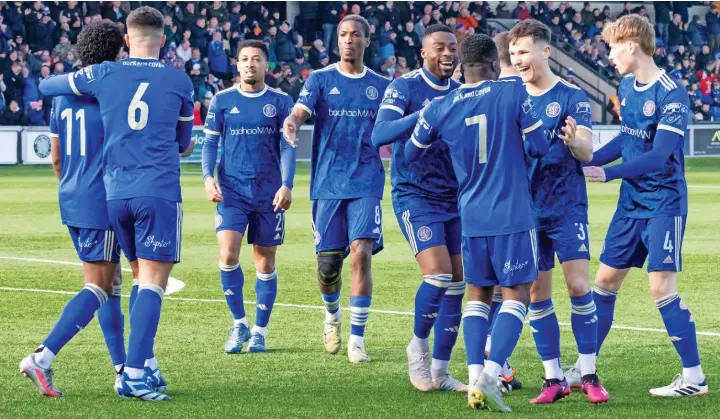  ?? Phil Jones/sportseyep­hoto.com ?? ●●The Silkmen celebrate the opening goal