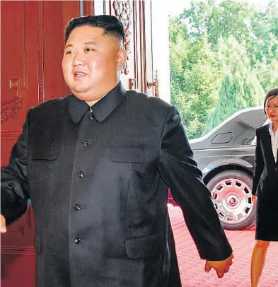  ?? U.S. STATE DEPARTMENT ?? A Rolls-royce sits in the background as Kim Jong Un arrives for a working lunch with U.S. Secretary of State Mike Pompeo on Sunday. It is unclear how the vehicle was transporte­d to Pyongyang.