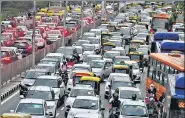  ?? ANI & RAJ K RAJ/HT PHOTO ?? Water level of Beas river flows above the danger mark in Kullu. (Right) Traffic jam at ITO in New Delhi after rainfall.