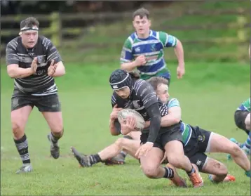  ??  ?? Gorey’s Aaron Davies tackles Willie Schutz (Dundalk) in the clash at Mill Road on Saturday.