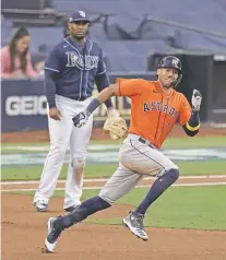  ?? JAE C. HONG/ASSOCIATED PRESS ?? The Astros Carlos Correa runs to second after hitting a double against the Rays on Friday in Game 6 of the AL Championsh­ip Series in San Diego. Game 7 is tonight.