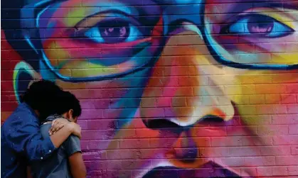  ?? Photograph: Kevin Mohatt/Reuters ?? People visit a mural of Elijah McClain in Denver, Colorado, on 8 August 2020.