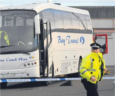  ?? Picture: David Wardle. ?? The scene of the accident in a car park in Dunfermlin­e where schoolboy Danny Reynolds, below, was struck by a bus.