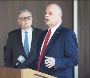  ??  ?? Stamford Director of Public Safety Ted Jankowski, right, speaks beside Mayor David Martin about new mental health initiative­s in policing at the Stamford Police Department on Wednesday.