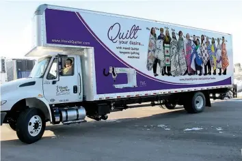  ??  ?? BOTTOM: Farquhar and the Handi Quilter ‘inspiratio­n squad’ have their photo on the side of a truck. PHOTO COURTESY OF MARILYN FARQUHAR