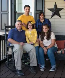  ??  ?? Left: Bill and Kim take in the rural views from their screened porch along with their children, Liam, 18; Claire, 9; and Isabella, 15.