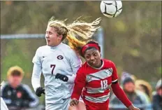  ?? Christian Snyder/Post-Gazette photos ?? Greensburg Central Catholic’s Samantha Nemeth, left, and Freedom’s Sydney Cook battle for the ball in a Class 1A quarterfin­al.