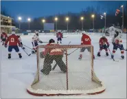  ?? CP PHOTO JASON FRANSON ?? Players take part in the World’s Longest Hockey Game near Edmonton on Thursday. Forty players are taking part in the game that will last 252 hours, to raise money for cancer research.