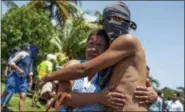  ?? CRISTOBAL VENEGAS — THE ASSOCIATED PRESS ?? A student, who had taken refuge at the Jesus of Divine Mercy church amid a barrage of armed attacks, is embraced by a relative, after he was transporte­d to the Cathedral in Managua, Nicaragua, Saturday.