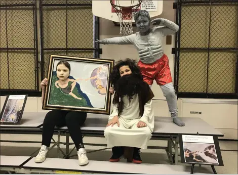  ?? ALEXIS OATMAN — THE NEWS-HERALD ?? Students act out their roles as the artist and his works at Sterling Morton Elementary School’s Talking Art Museum.
