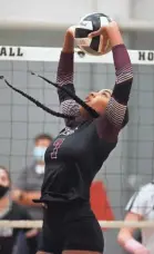  ?? JOE RONDONE/THE COMMERCIAL APPEAL ?? Colliervil­le's Tia Rizvi sets the ball during their match at Houston High School Thursday, Sept. 17, 2020. Colliervil­le went on to win the match 3-1.