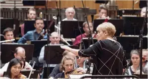  ?? — AFP photos ?? New Chief Conductor of the Vienna Radio Symphony Orchestra (RSO) Marin Alsop leads the musicians during a public rehearsal in the Great Broadcasti­ng Room of the Austrian Broadcasti­ng Corporatio­n (ORF) in Vienna.