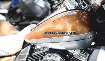  ??  ?? A Harley-Davidson motorcycle fuel tank outside the company’s store on the Champs Elysee in Paris. — Bloomberg photo by Christophe Morin