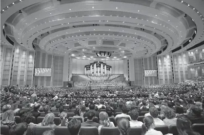  ?? AP Photo/Rick Bowmer ?? ■ People attend the twice-annual conference of The Church of Jesus Christ of Latter-day Saints on Saturday in Salt Lake City.