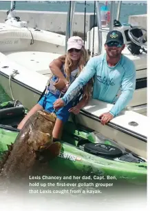  ??  ?? Lexis Chancey and her dad, Capt. Ben, hold up the first-ever goliath grouper that Lexis caught from a kayak.