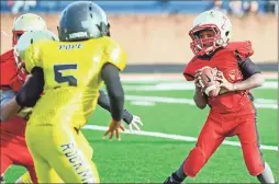  ?? / Rome City Schools ?? Rome’s Justin Spivey looks for an opening to run through during the Wolves’ game against Rockmart in the NWGYFL 8U DI Superbowl.