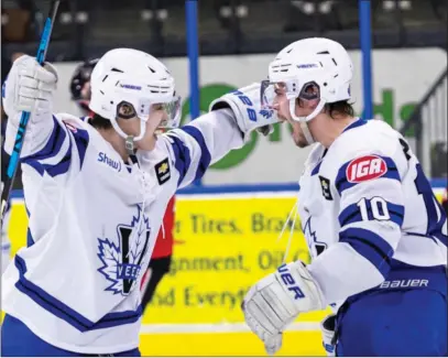  ?? CHERIE MORGAN PHOTOGRAPH­Y/Special to the Okanagan Newspaper Group ?? Nic DeGraves and Mason Poolman celebrate as the Penticton Vees scored a 4-3 win over the Alberni Valley Bulldogs in Game 1 of the BC Hockey League playoff championsh­ip series. Game 4 is tonight in Port Alberni.