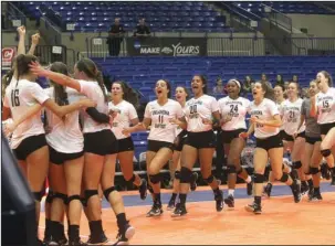  ?? The Sentinel-Record/Richard Rasmussen ?? SWEET VICTORY: Members of the Oklahoma Baptist volleyball team celebrate after beating Ouachita Baptist in the first round of the Great American Conference tournament Thursday at Bank of the Ozarks Arena. The Lady Bison will face Harding in the...