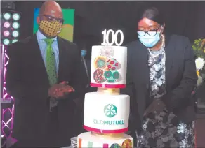  ?? Photo: Paheja Siririka ?? Cheers to 100!… Prime Minister Saara Kuugongelw­aAmadhila, cutting Old Mutual’s centenary cake, with CEO Kosmas Egumbo looking on.