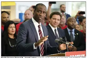  ?? (AP/Chris O’Meara) ?? Florida Surgeon General Dr. Joseph Ladapo gestures as he speaks to supporters and members of the media before a bill signing by Gov. Ron DeSantis in November 2021 in Brandon, Fla.