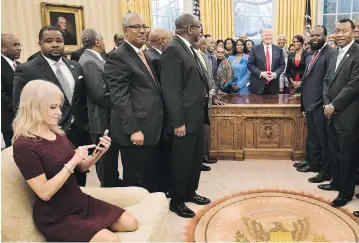  ?? BRENDAN SMIALOWSKI / AFP / GETTY IMAGES ?? Kellyanne Conway, aide to President Donald Trump, is getting flak for a photo of her on a couch in the Oval Office with her shoes on. She had just taken a photo of Trump with leaders of historical­ly black colleges and universiti­es.