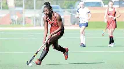  ?? Picture: JACKIE CLAUSEN ?? STRATEGIC MOVE: Matipa Karimazond­o of Kingswood College pushes forward and considers her options during one of the 44 matches making up the Kingswood hockey festival for boys’ and girls’ first hockey teams. In addition to Makhanda schools, teams came from Somerset West, George, Knysna and Gqeberha.